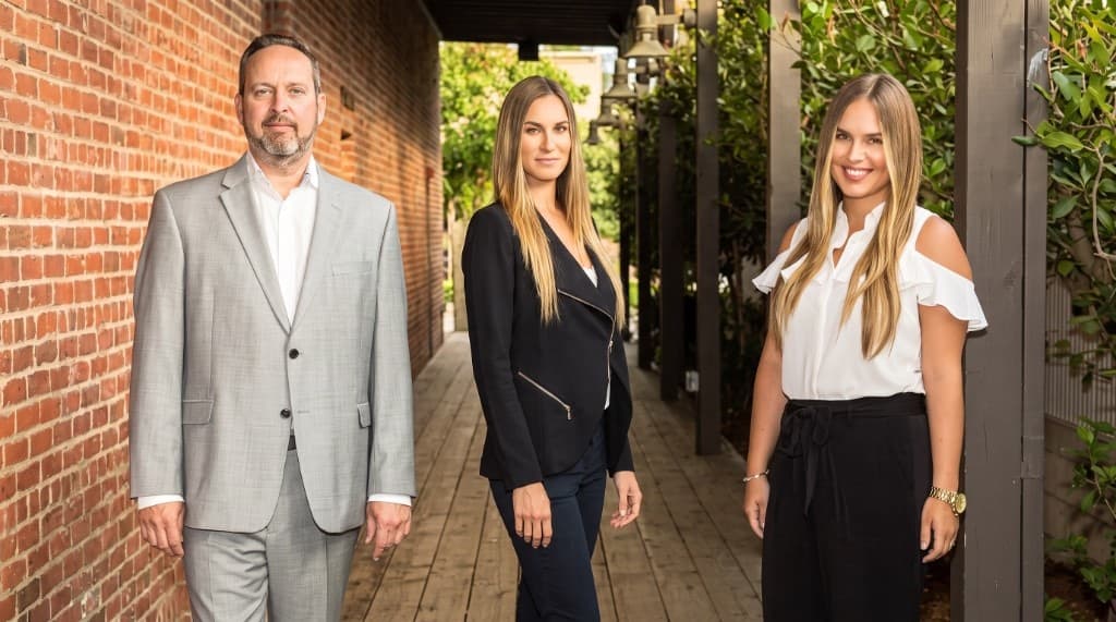Robert Matilla, Jessica Miller, and Alissa Hill of Robert Cole Properties